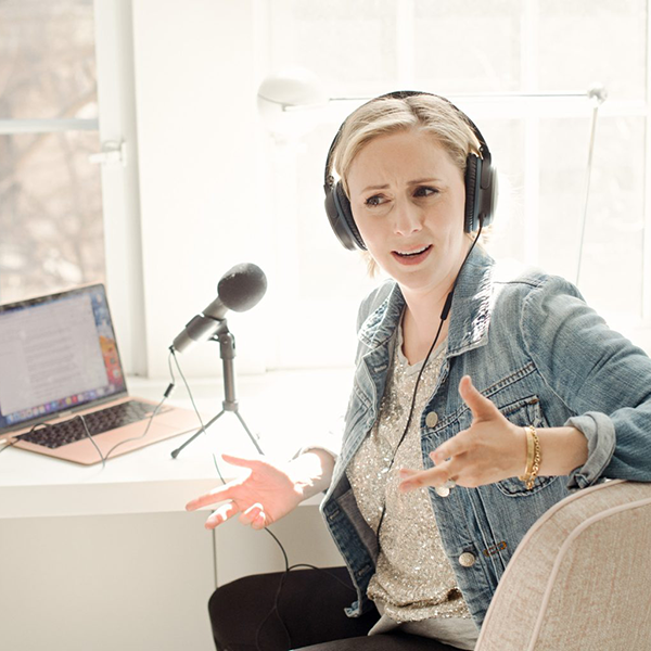 Alissa with podcasting equipment